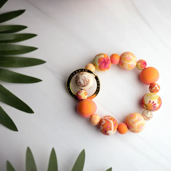 Beaded keychain with floral pattern.