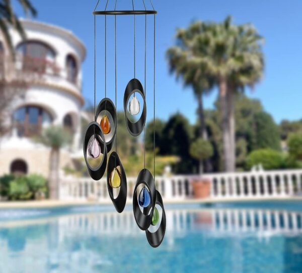 Black metal wind chime with colorful glass drops.