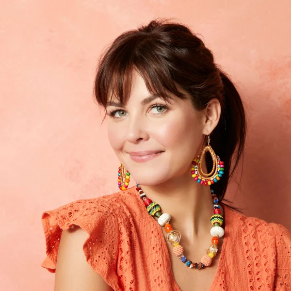 Woman wearing colorful beaded jewelry.