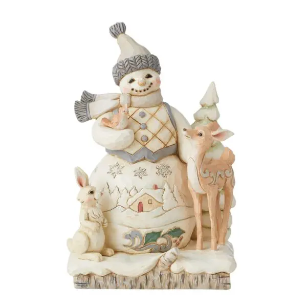 Snowman figurine with animals and trees.