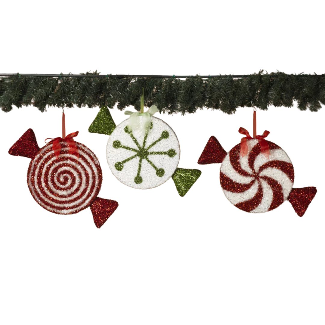 Here's an 8-word alt tag for the image: Christmas candy cane ornaments hanging from garland.